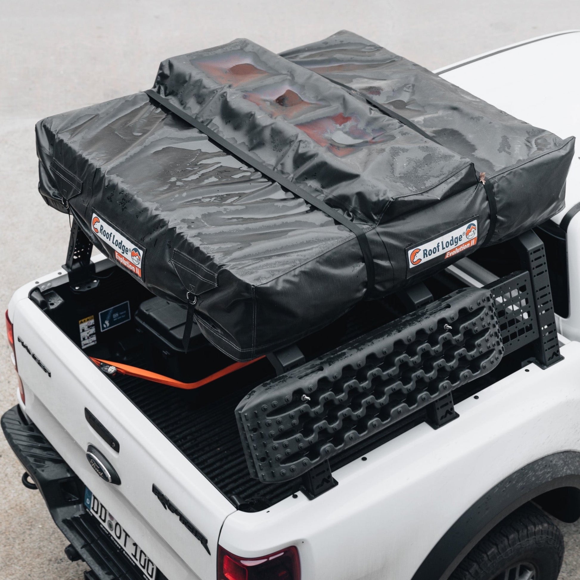 Top view of DOT bed rack with roof tent and molle panel on white Ford Pick Up